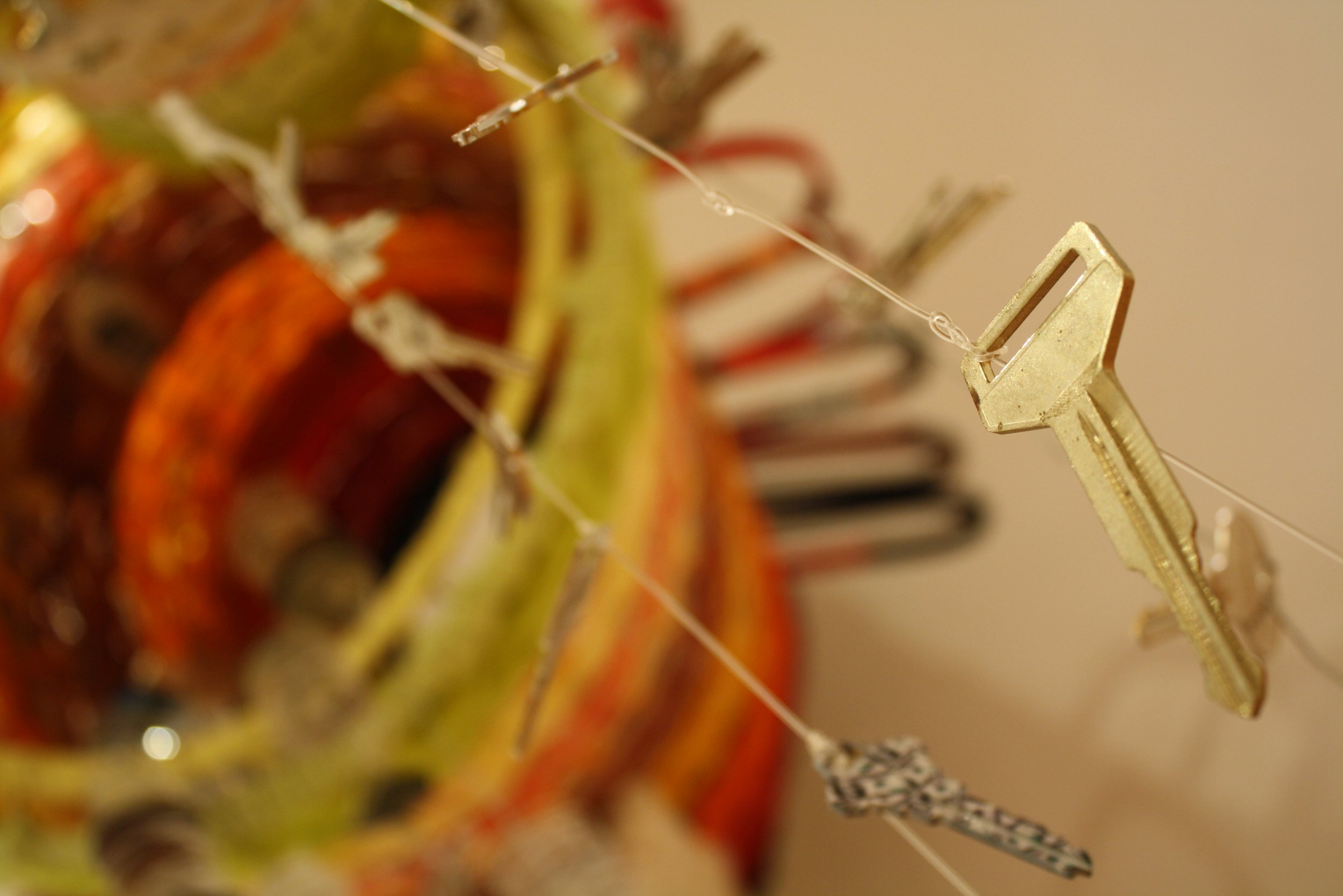  House keys hang from Kim Keelor’s 3D woven sculpture titled  Mildness Bombardment I and II  displayed at the Contemplating Helene opening reception at the Black Mountain Center for the Arts, on Sep. 4, 2026, Black Mountain, N.C. (Echo/Emma Taylor Mc