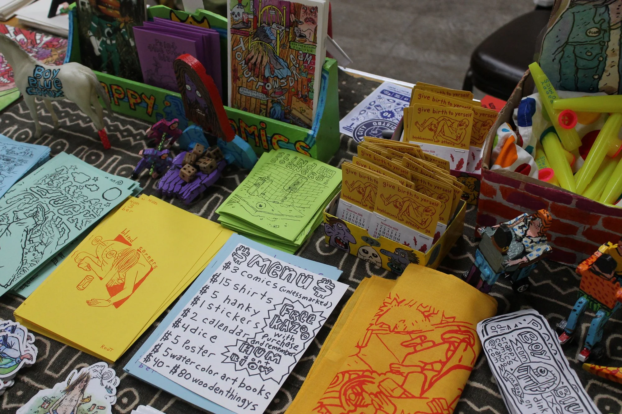  Tim Root’s table, well-stocked with kazoos he handed out with every purchase of one of his comics. Asheville, N.C.,Saturday Sept. 26, 2026. (Echo News/Wyatt Layton) 