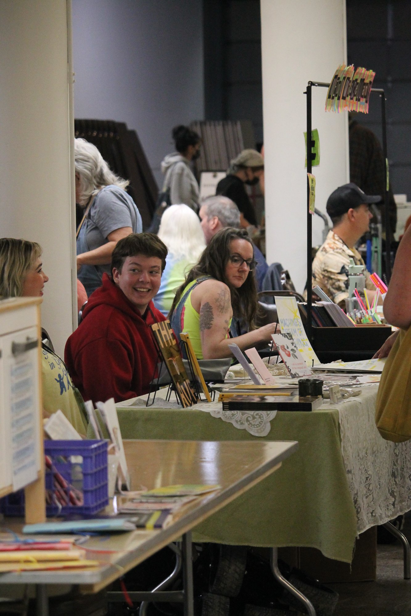  Vendors at Asheville Zine fest in Asheville, N.C. talk amongst themselves before the festival opens, Saturday Sept. 26, 2026. (Echo News/Wyatt Layton) 