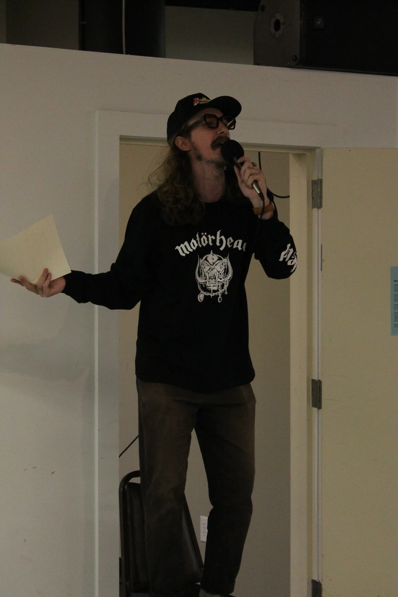  An emcee stands on a chair to announce the schedule of events at Asheville Zine Fest in Asheville, N.C., Saturday Sept. 26, 2026. (Echo News/Wyatt Layton) 