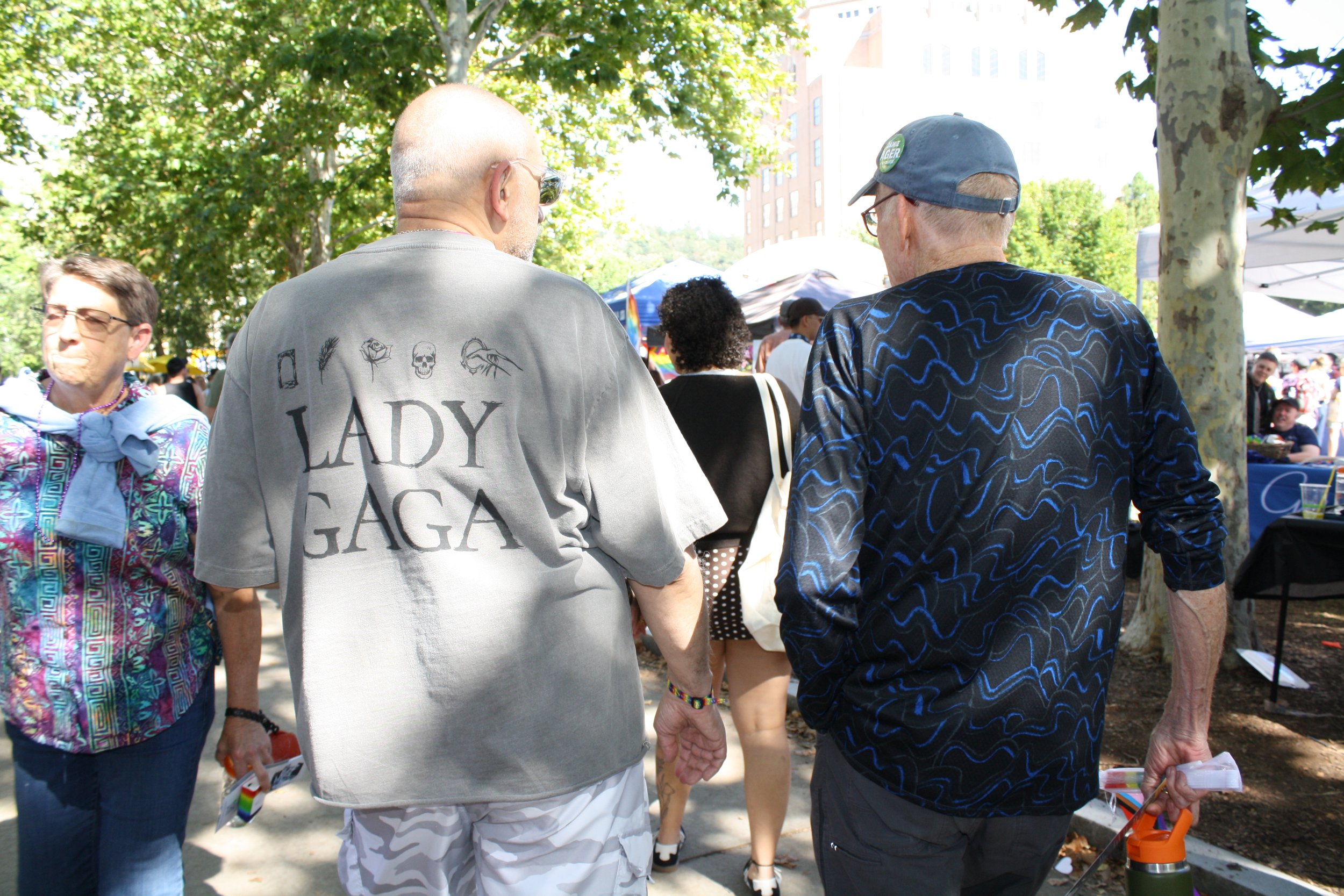  Two attendees of Blue Ridge Pride walk through Pack Square Park. One wears a “Lady Gaga” shirt. Sep. 26, 2026 in Pack Square Park in Asheville, N.C. (Echo/Emma Taylor McCallum) 