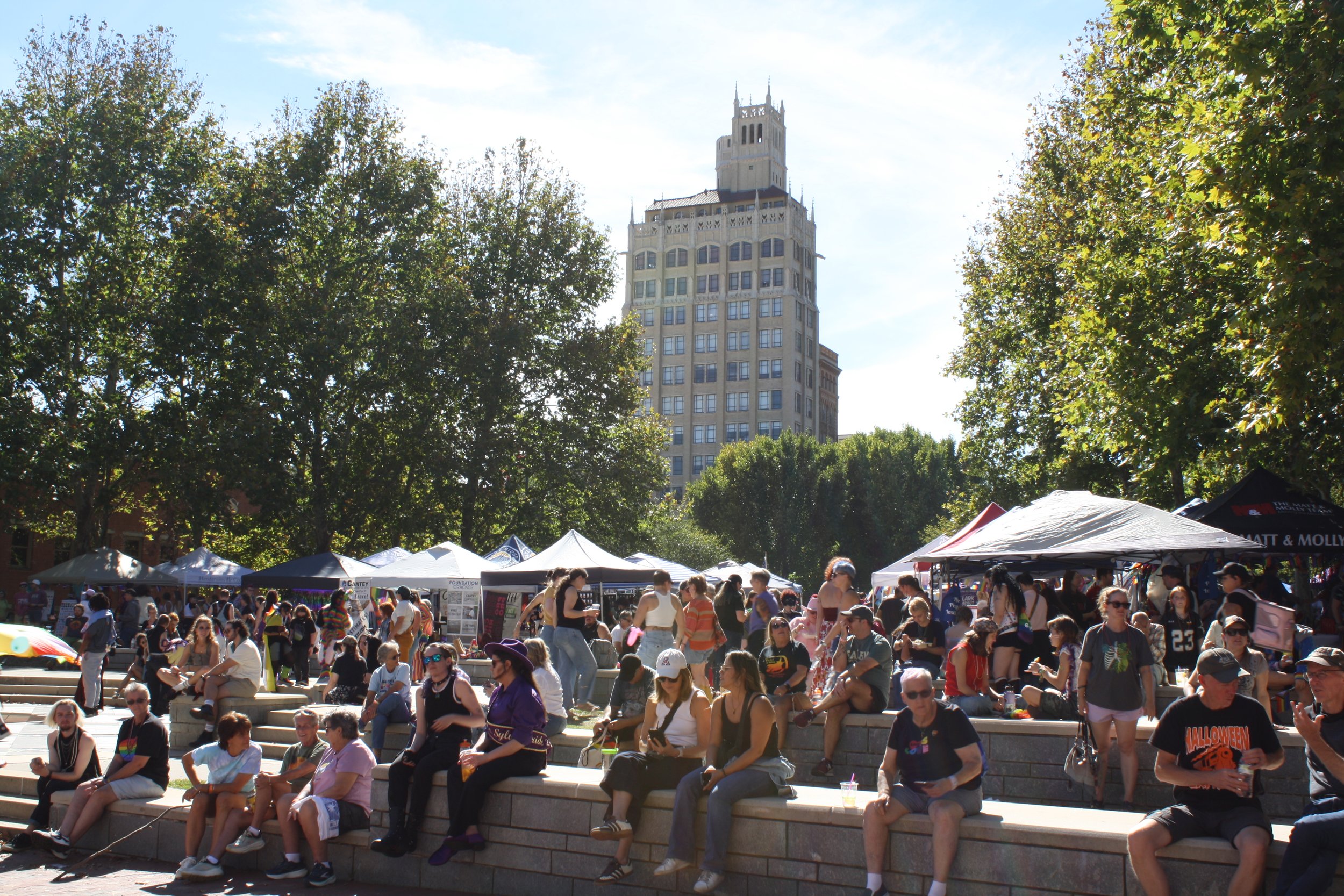 The stone benches at Pack Square Park amphitheater filled with people watching&nbsp; speakers at Blue Ridge Pride on Sep. 26, 2026 in Pack Square Park in Asheville, N.C. (Echo/Emma Taylor McCallum) 