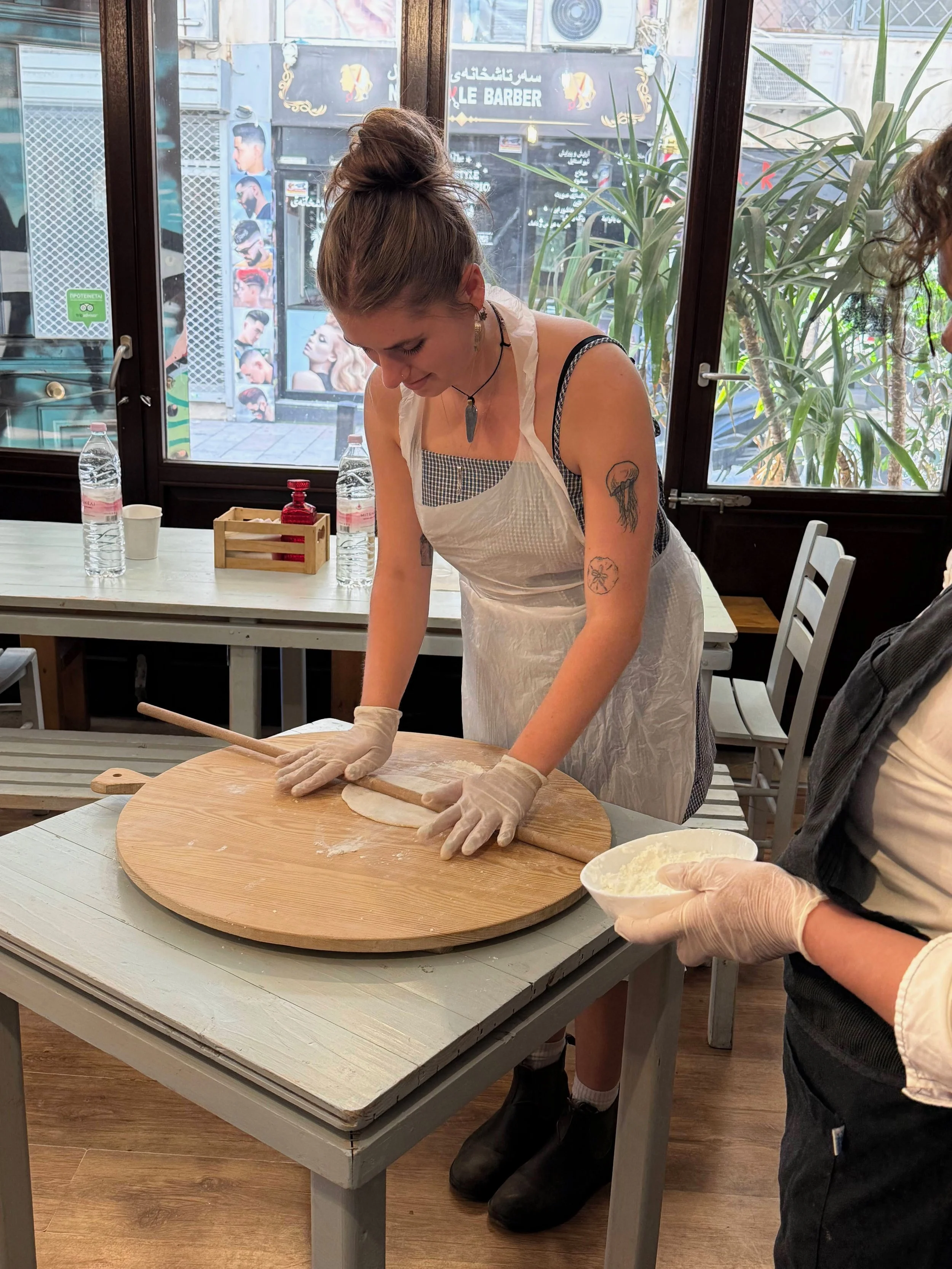  Sabine Costello-Sanders rolls out filo dough for spanakopita in Thessaloniki, Central Macedonia, Greece May 12, 2026 (courtesy of Jill Arnold) 