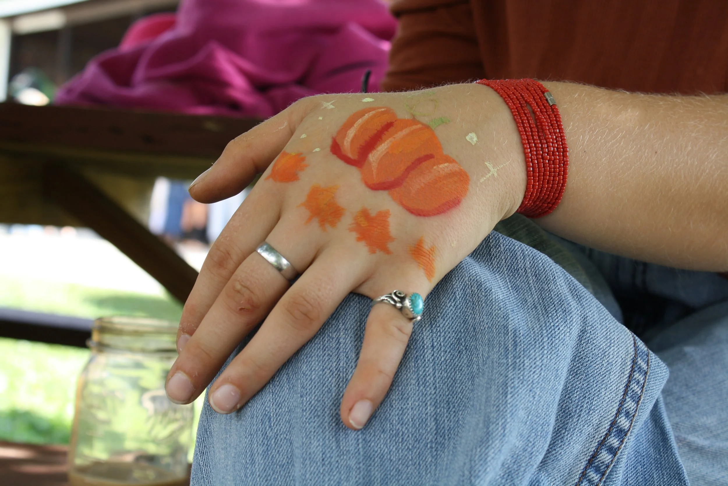  Solena Davidson Carroll sporting a pumpkin painting on her hand during the Fall Fest at Warren Wilson College on Oct. 3, 2026. Swannanoa, N.C. (Echo/Emma Taylor McCallum) 