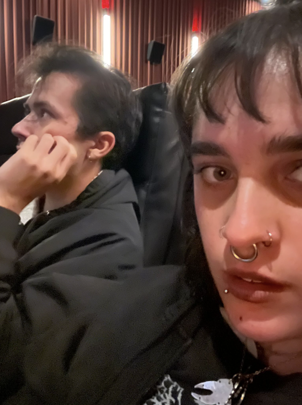  From left to right) Elliott Hove and Helena Cano sit in intense anticipation of the film “You Can See Everything” at the Cinemark Bistro in Asheville, N.C. (Courtesy of Helena Cano) 