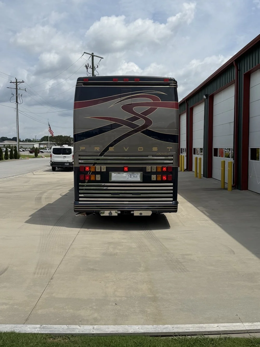 Rear view of the coach with taillights.