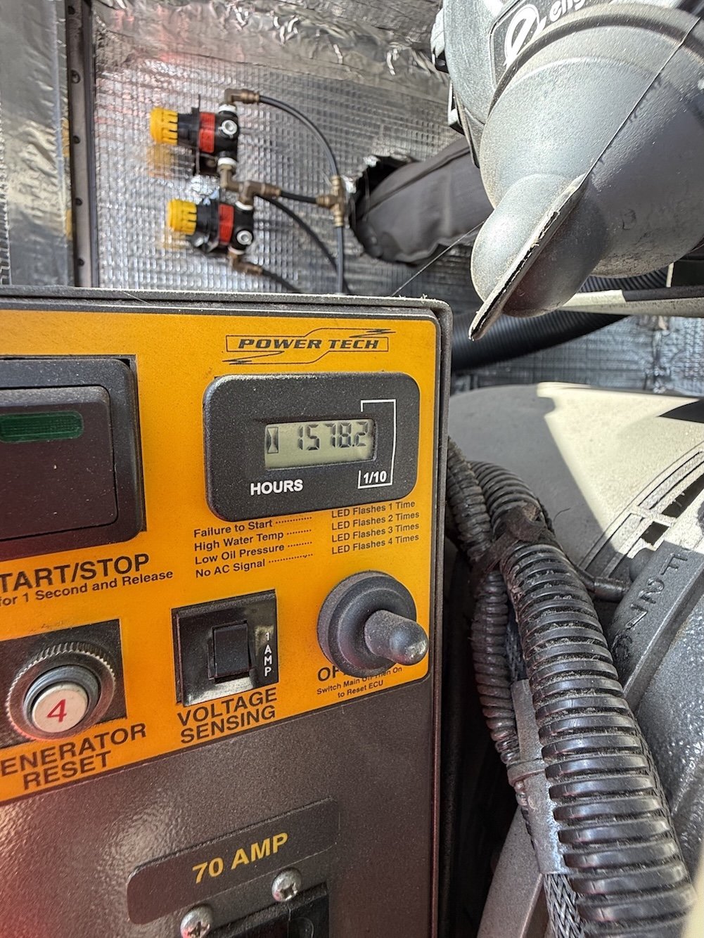 Close-up of the generator hour meter and control panel.