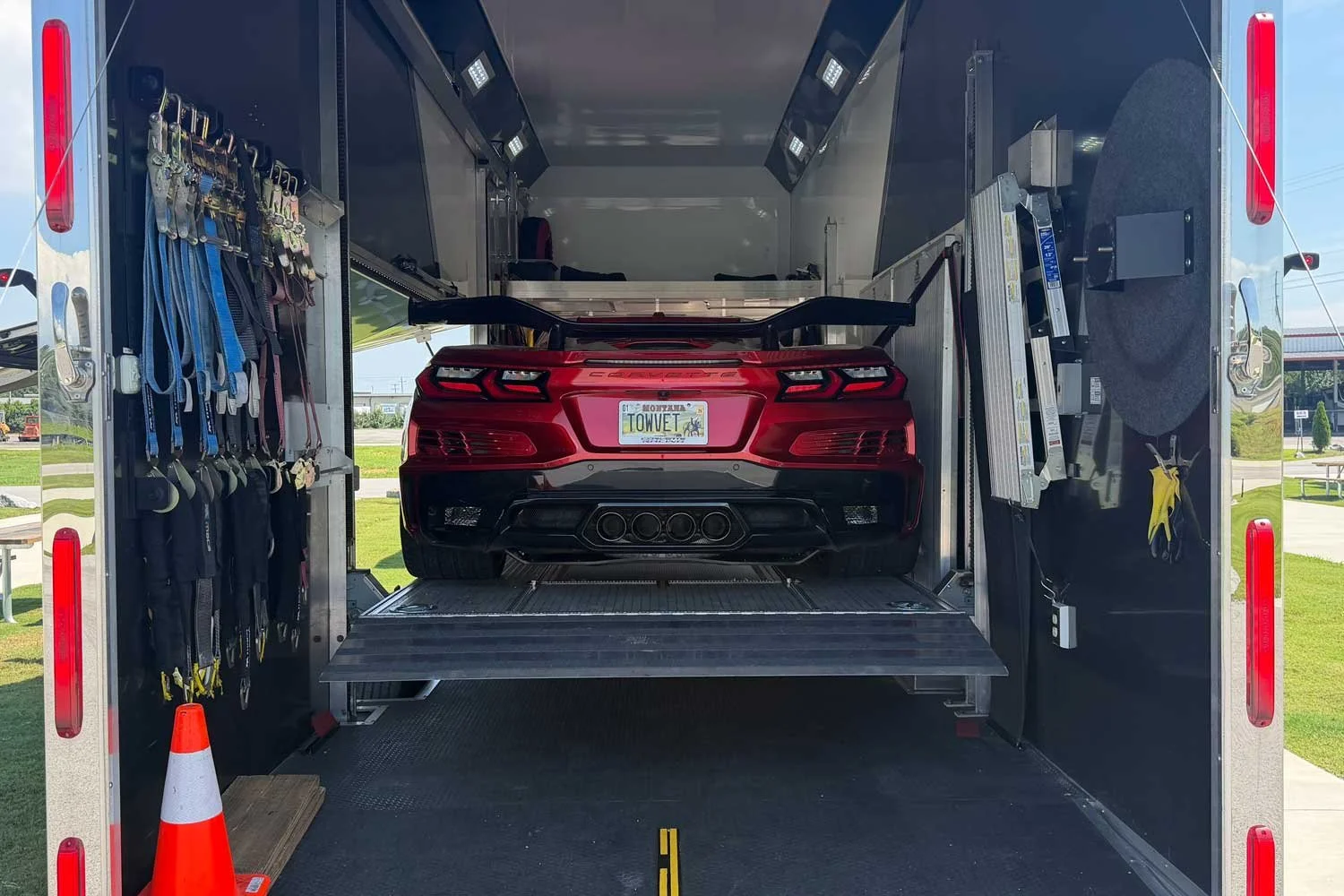Rear view of the Corvette loaded inside the trailer
