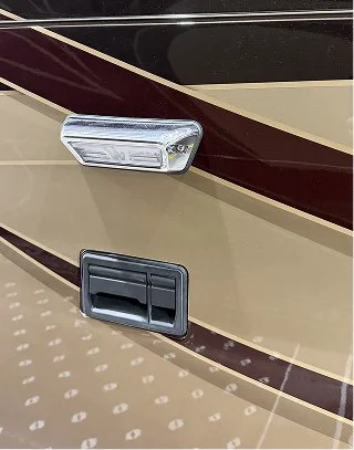 Side scene lamp assembly complete with its protective full rubber gasket installed on a coach panel.