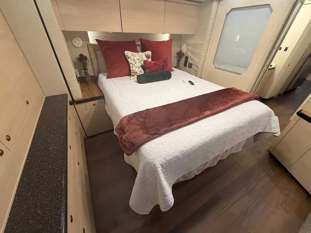 Master bedroom with made bed.
