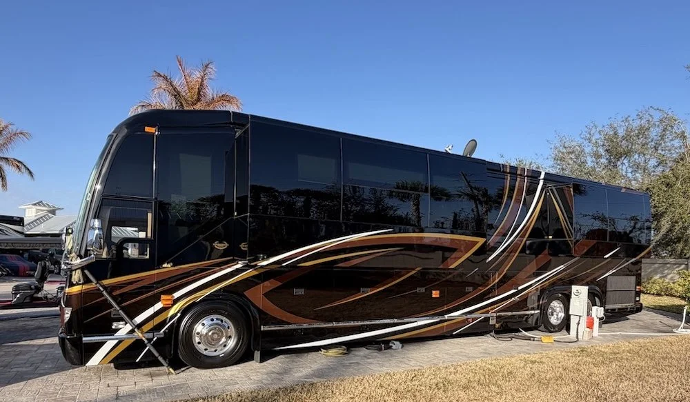 Driver-side exterior view of a black 2016 Prevost Marathon.