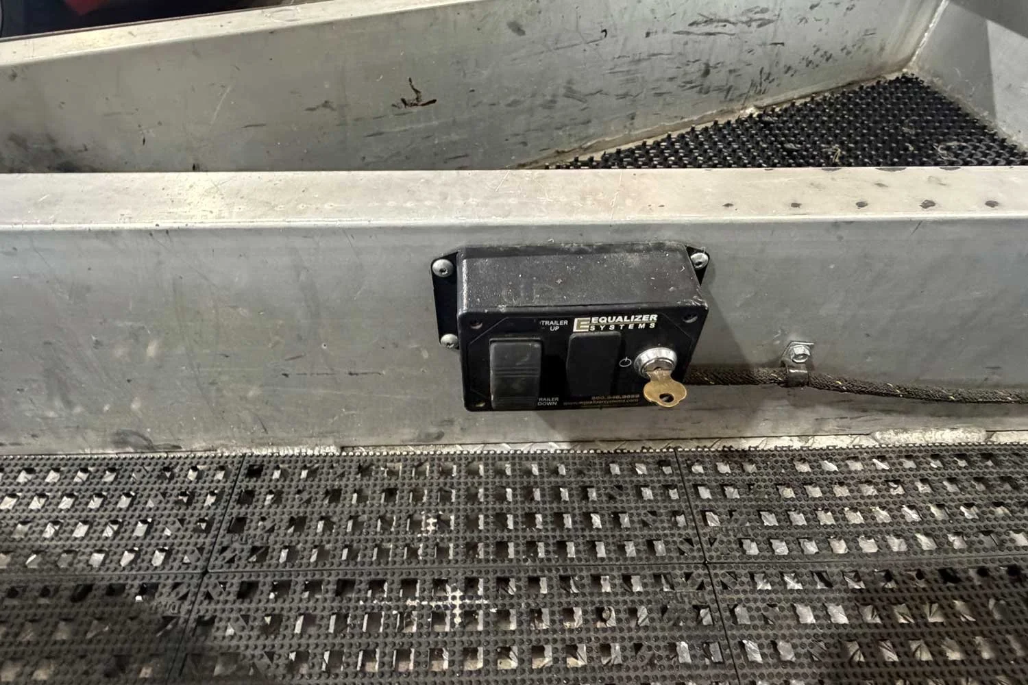 Close-up of the trailer jack up/down control switch