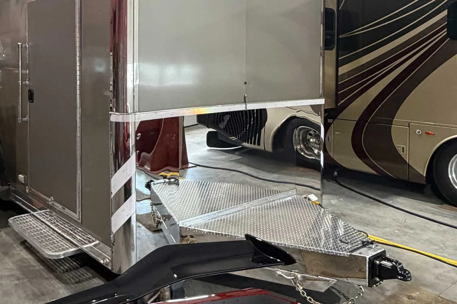 Rear view of the tongue between two parked motorcoaches