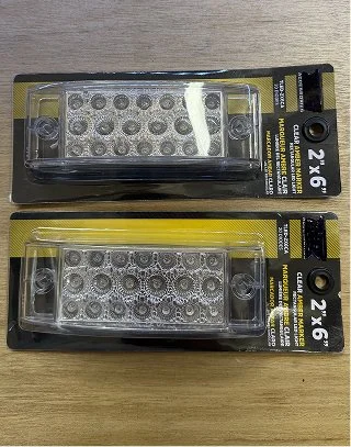 Two clear amber rectangular 2x6 LED marker lights in packaging.