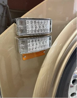 g: Close-up profile view of the stacked clear-lens LED marker lights.
