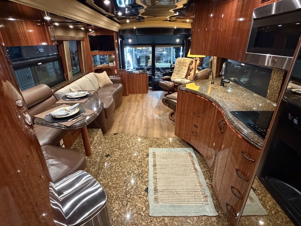 Inside luxury coach looking out from the bedroom into the living area.