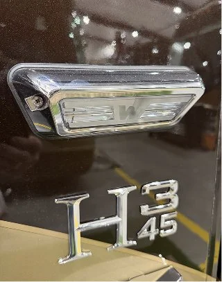 High-output side scene lamp with a low-profile housing mounted on coach.