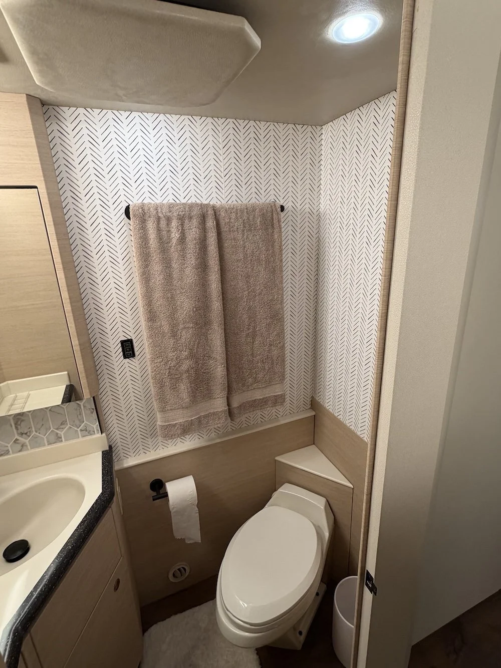 Bathroom sink, toilet, and towel rack