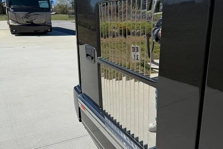 Close-up of polished stainless steel rear engine louver kit.