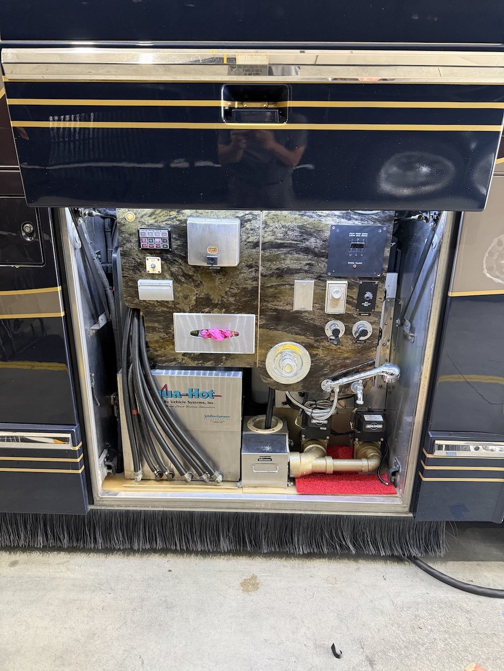 Utility bay with electrical panel.