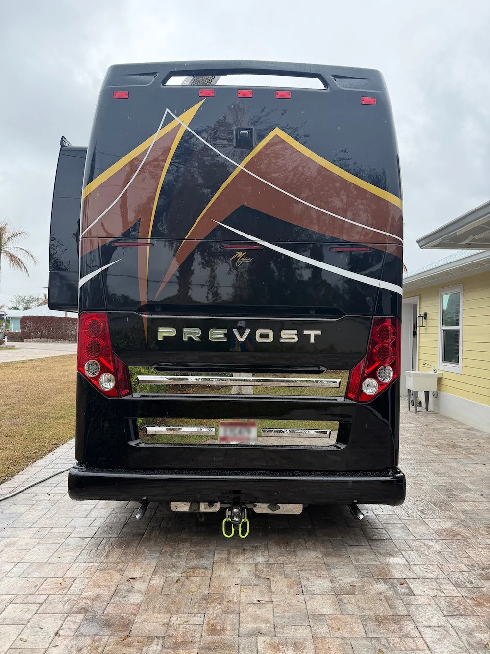 Rear-view perspective of the 2016 H3-45 showing the louvered engine door and slide depth.