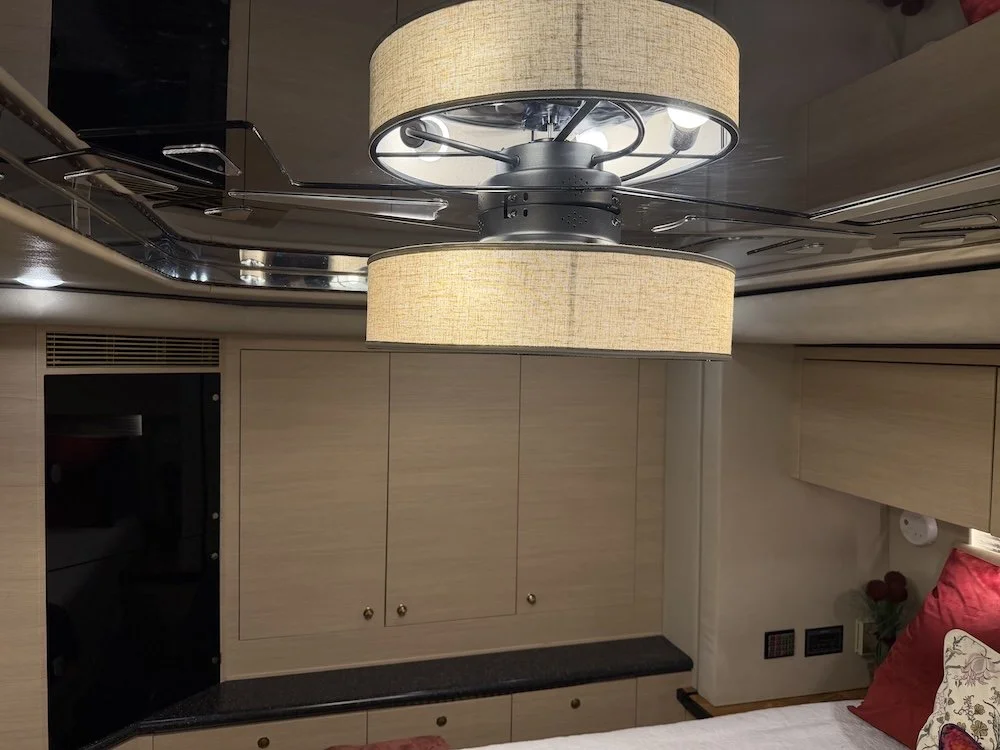 Ceiling fan light fixture with master bedroom storage.