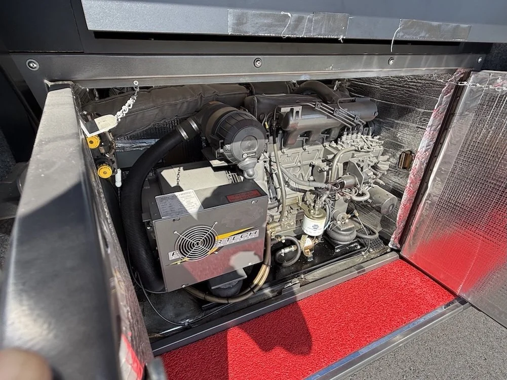 Slide-out generator unit housed in the front exterior compartment.