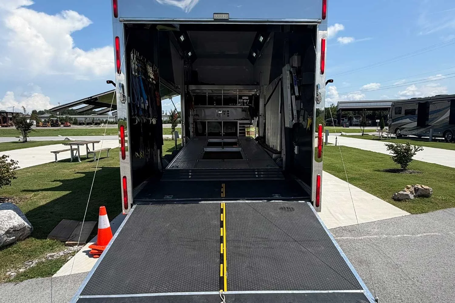 Open rear ramp leading into the trailer's lift deck