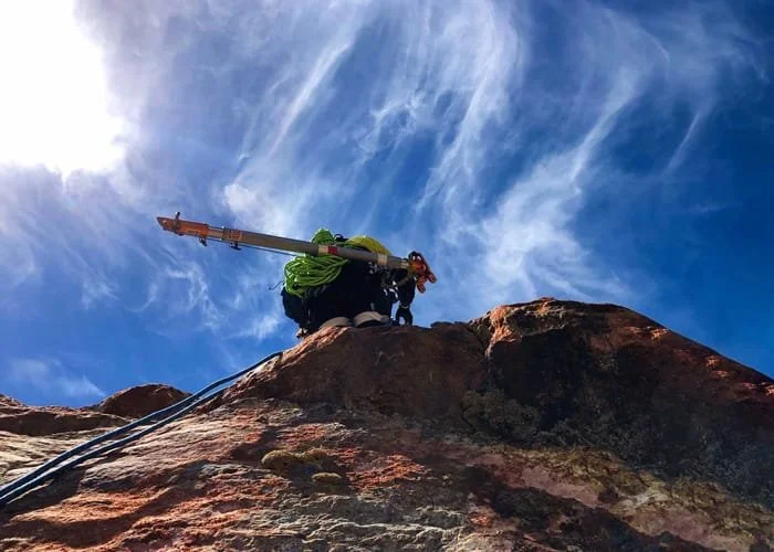 Climbing down a cliff