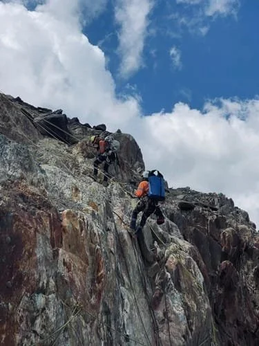 Climbing down a cliff