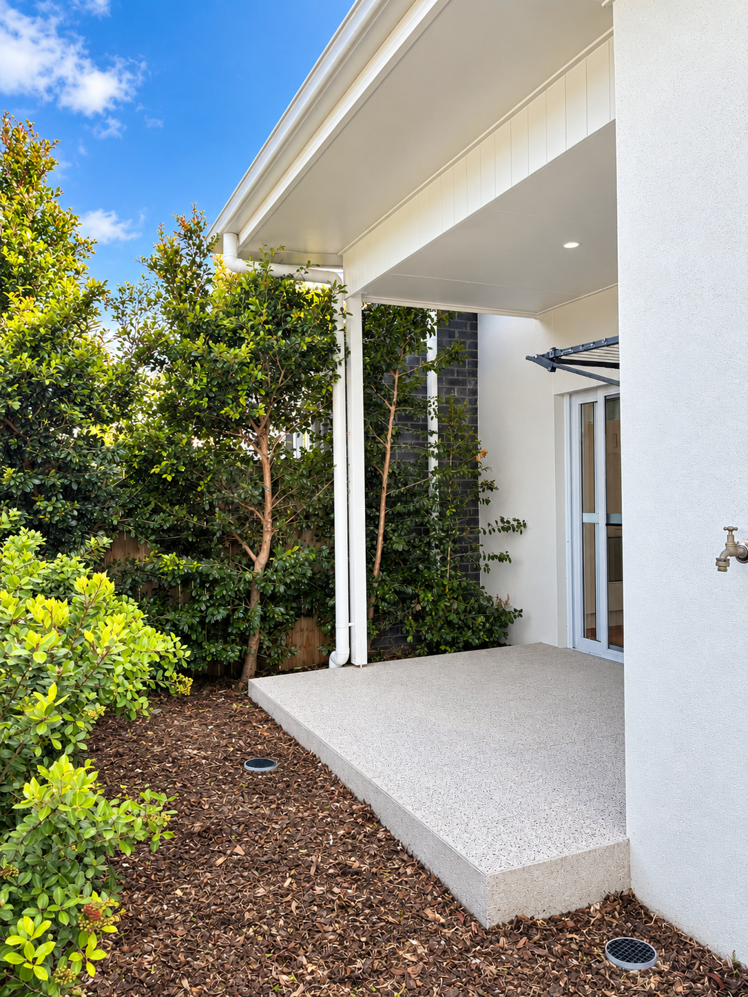 Modern Patio with Lush Landscaping.png
