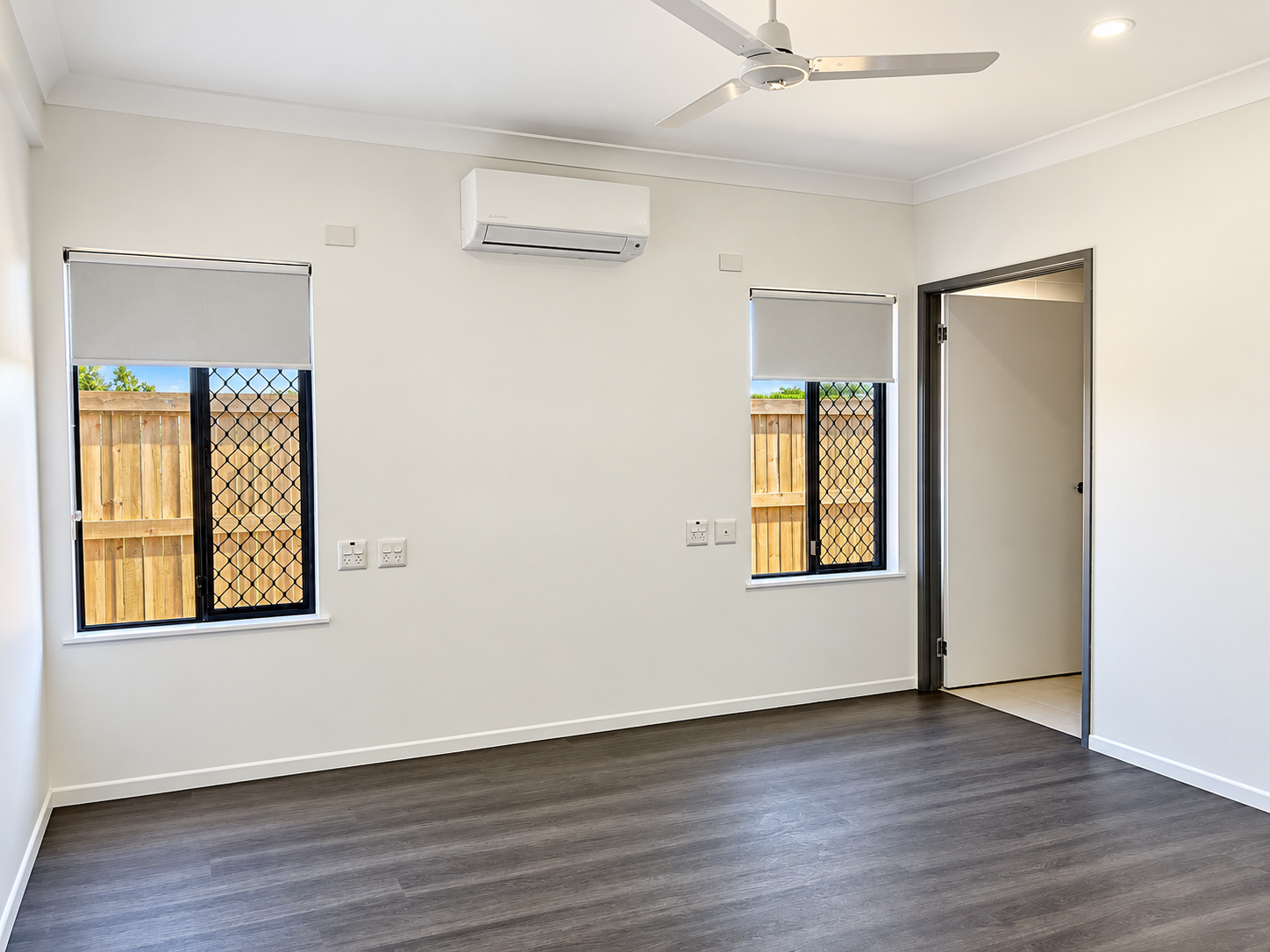 Empty Modern Room with Windows and Air Conditioning.png