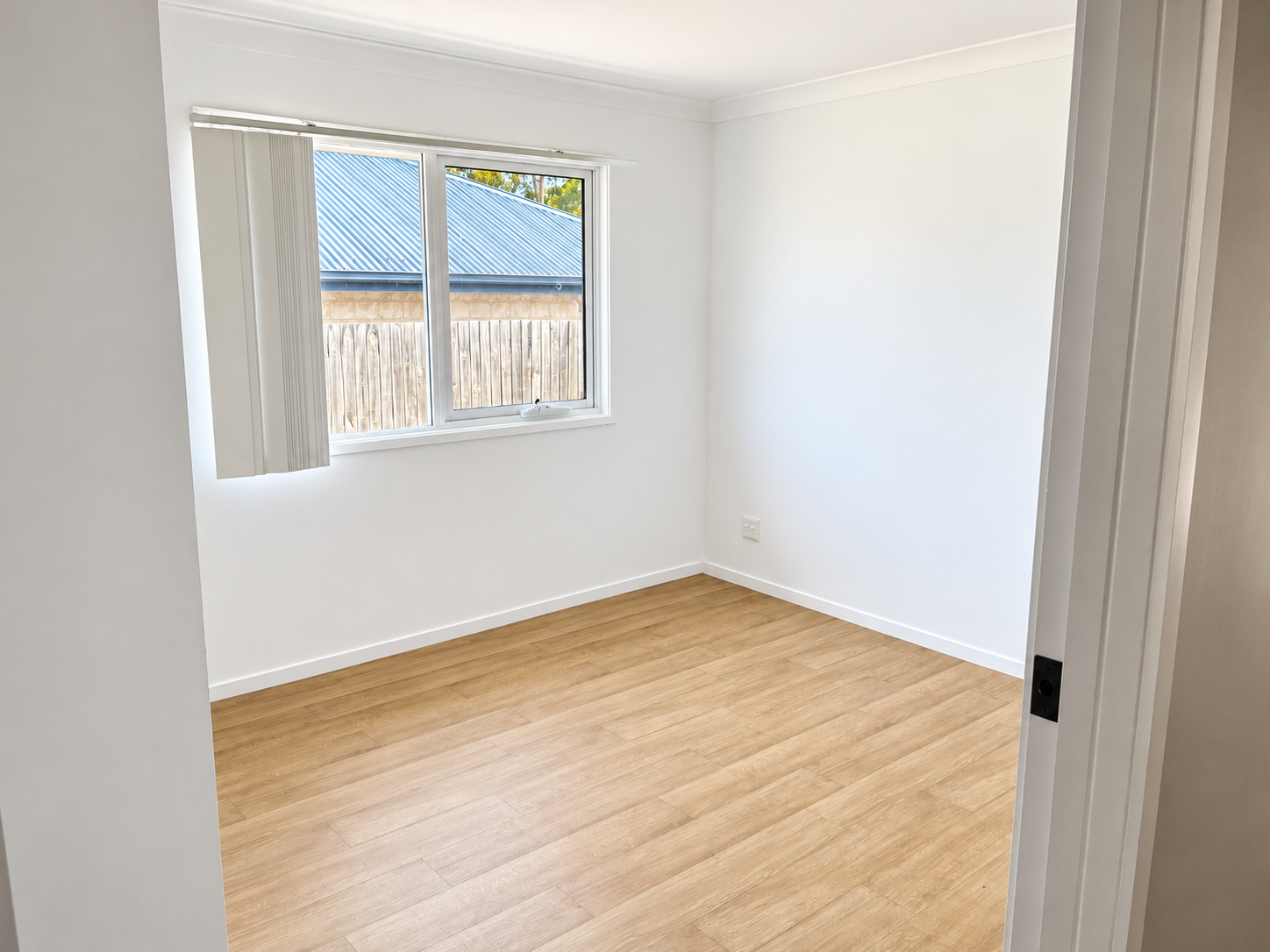 Bright Minimalist Empty Bedroom.png