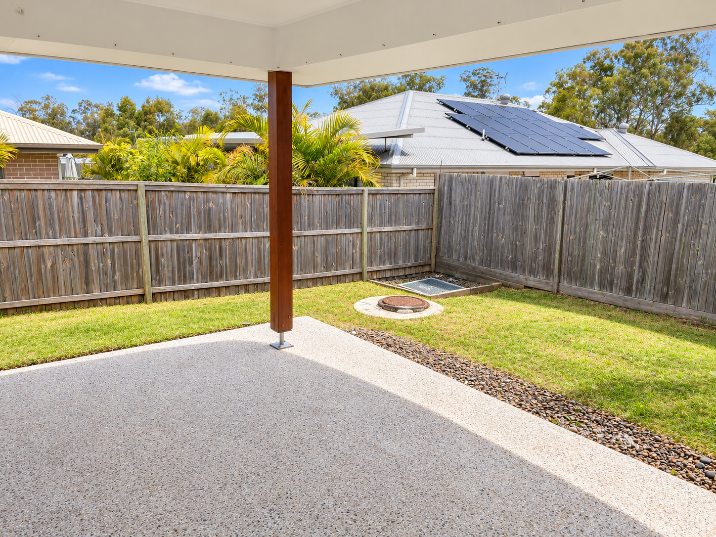 Bright Backyard Patio and Garden View.png