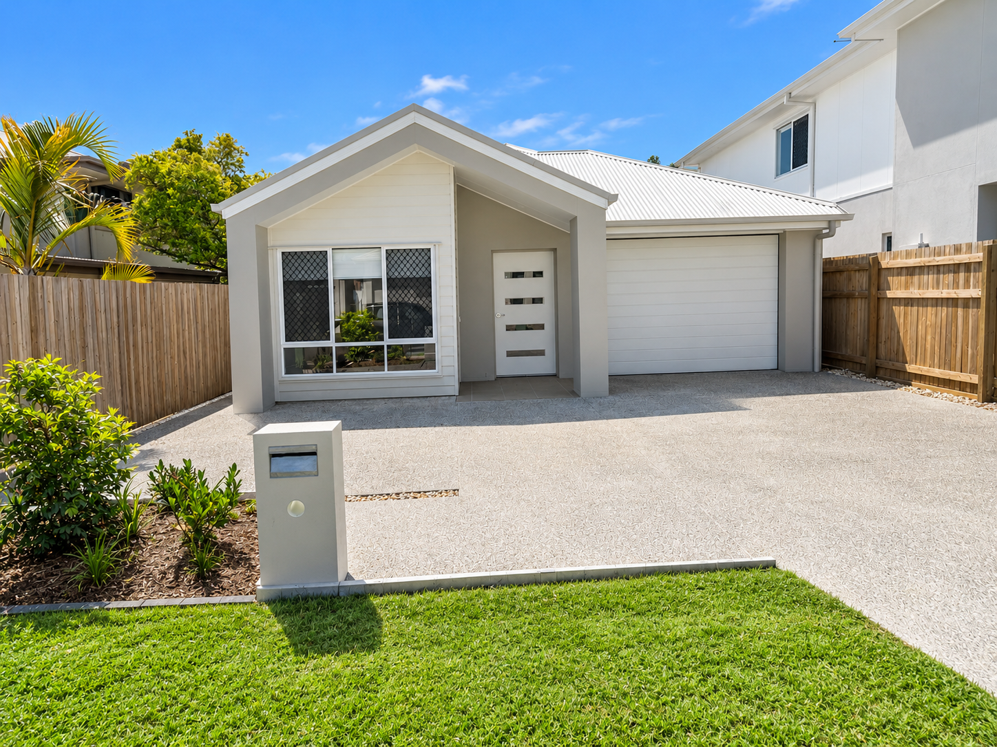 Modern Suburban Home with Number One Mailbox.png