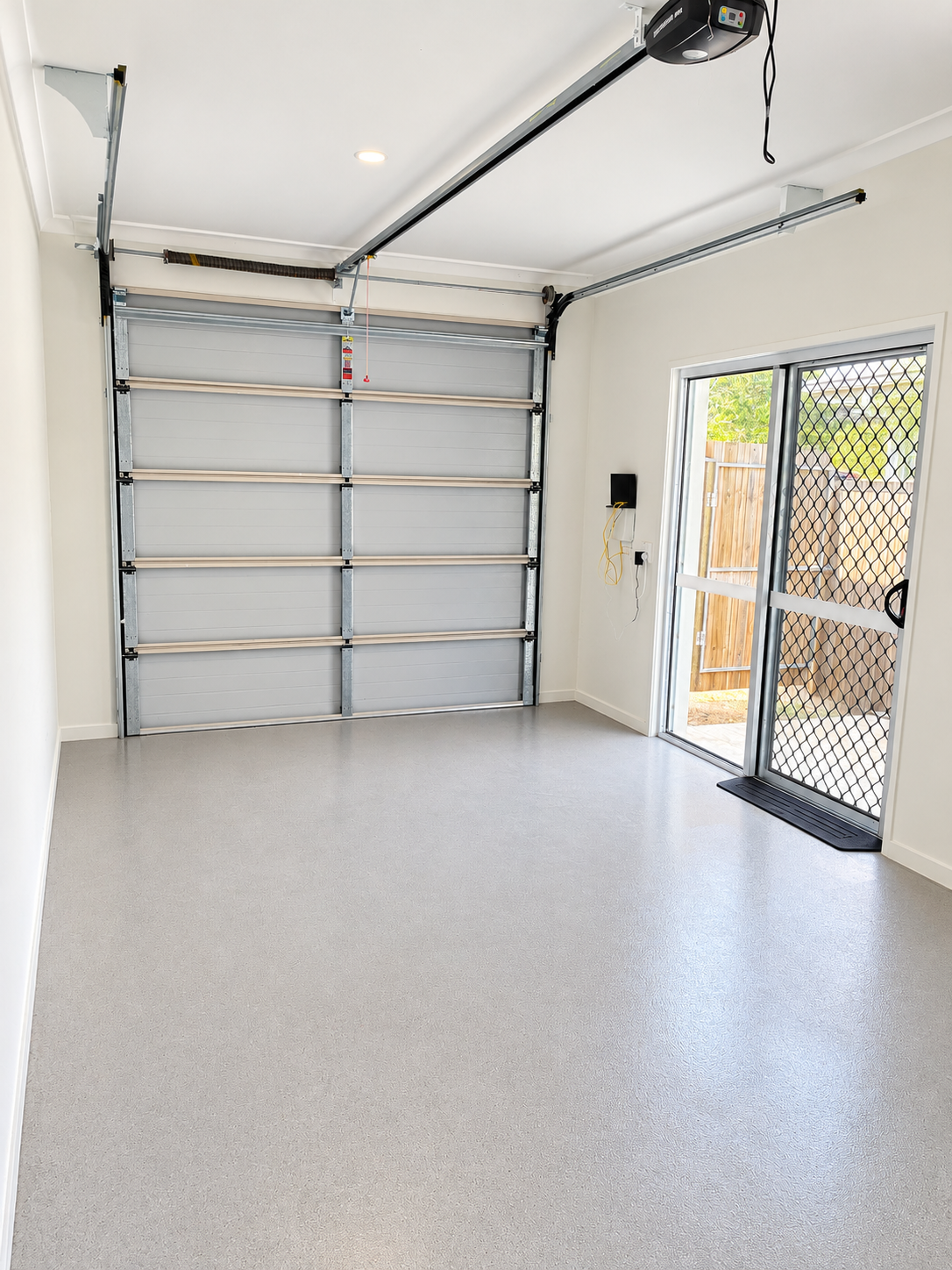 Bright Minimalist Empty Garage Interior.png