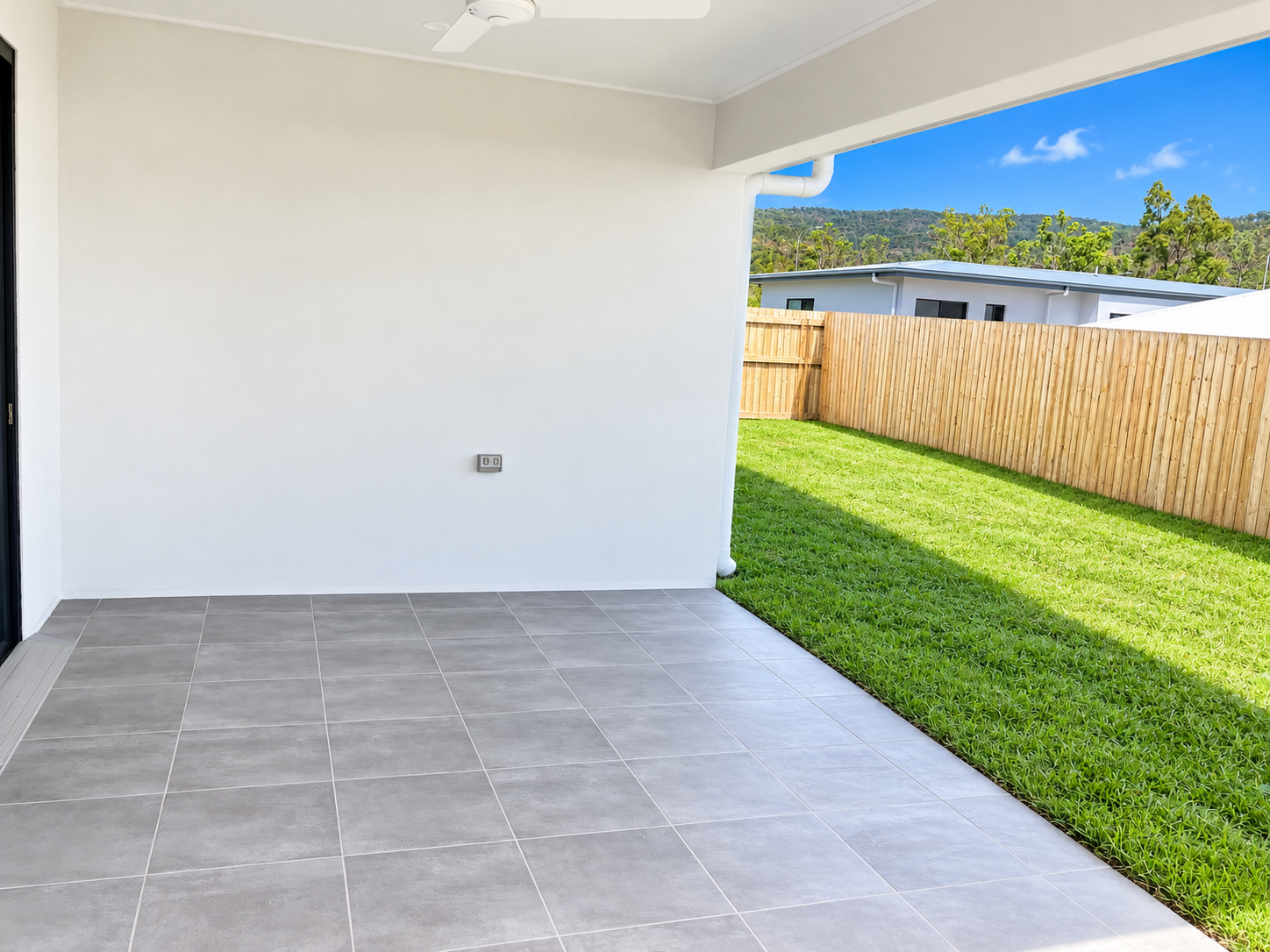 Modern Covered Patio Overlooking Green Hills.png