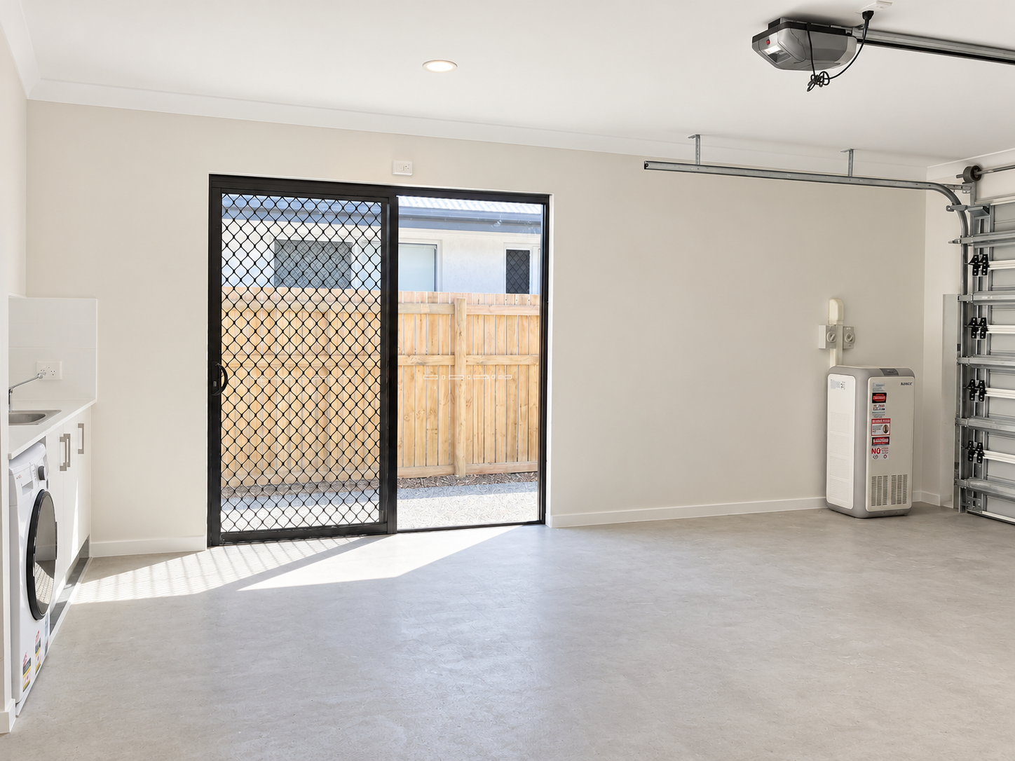Modern Garage Laundry with Sliding Security Door.png