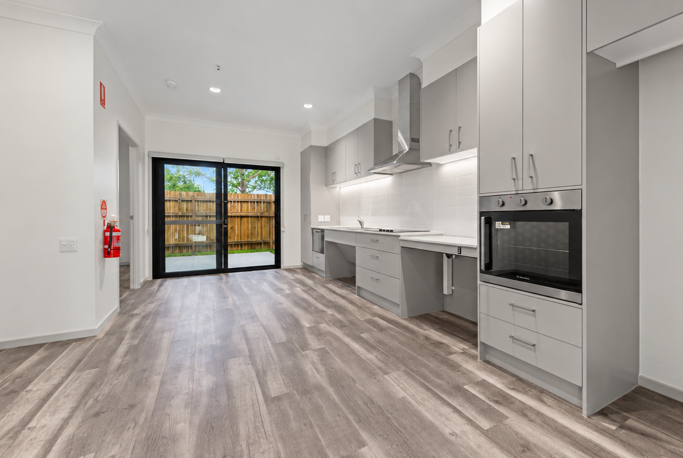 Bright Minimalist Kitchen with Tidy Patio View.png