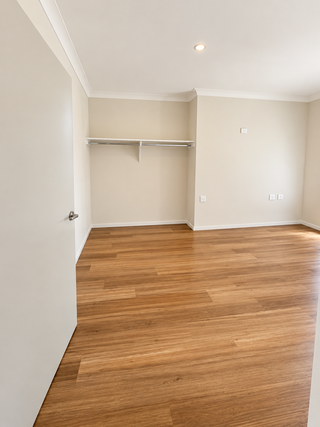 Bright Minimalist Room with Open Closet.png