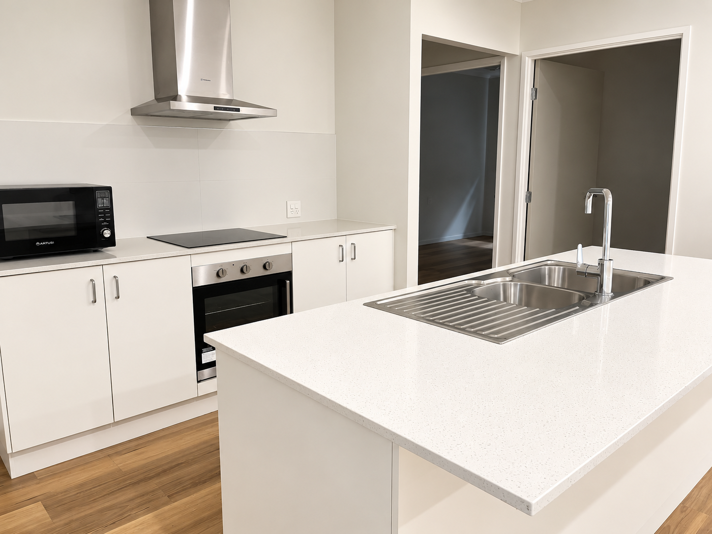 Modern Minimalist Kitchen with Island Sink.png