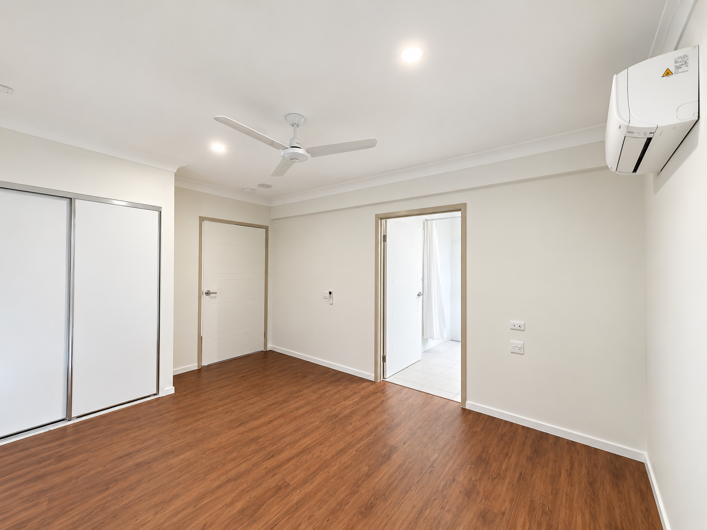 Bright Minimalist Bedroom With Ensuite.png