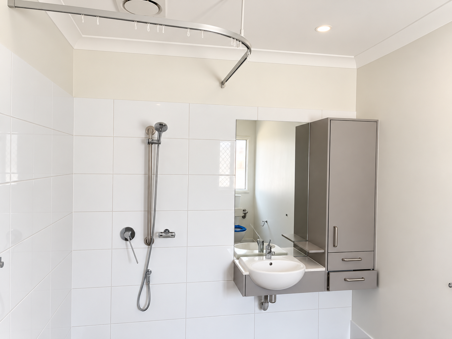 Bright Modern Bathroom with Curved Shower Rail.png