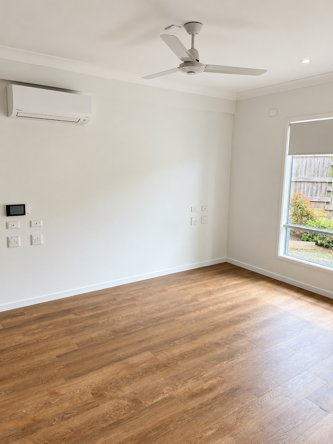 Bright Minimalist Room with Sunlit Wood Floors.png