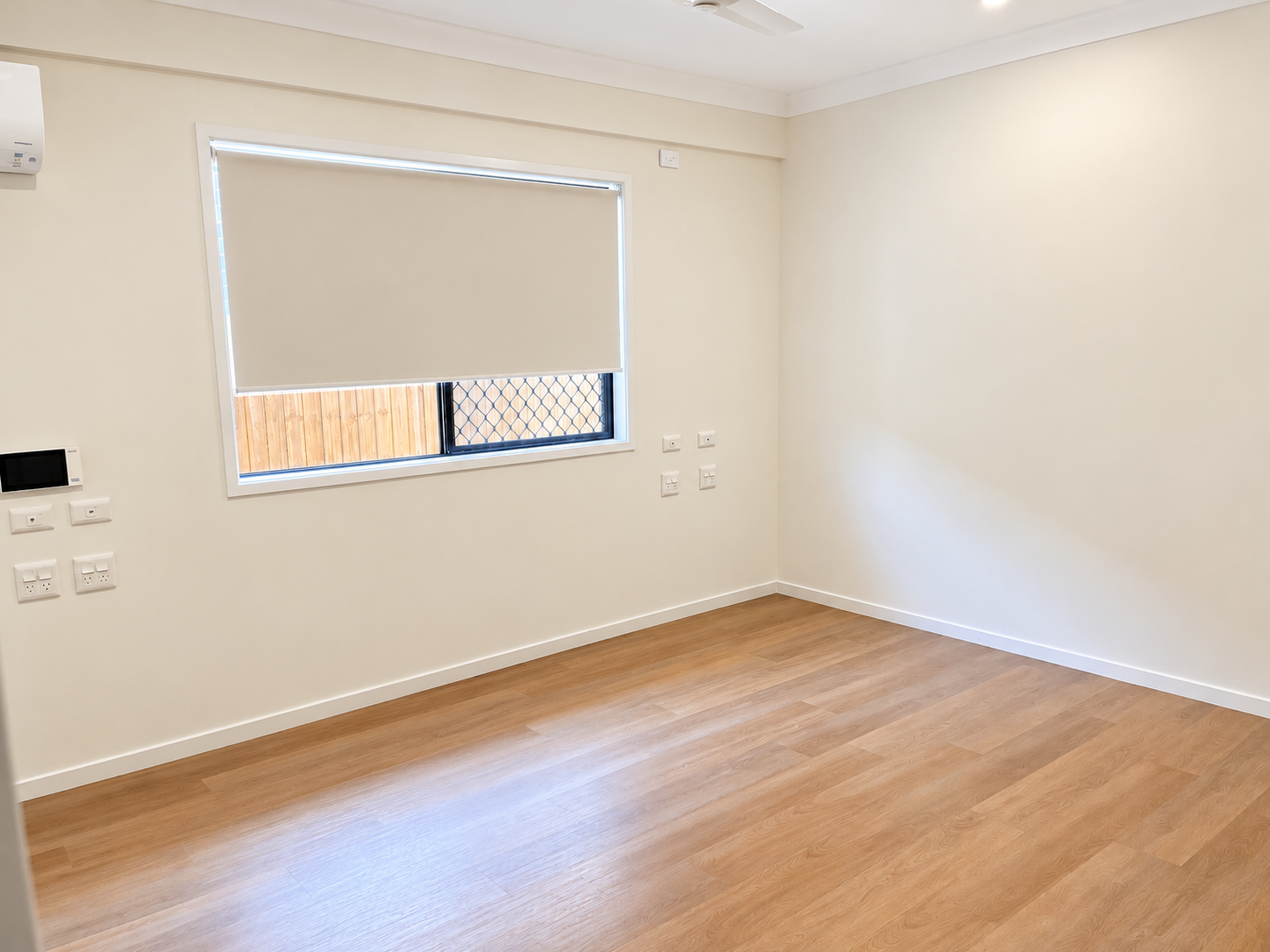 Bright Minimalist Empty Bedroom Interior.png