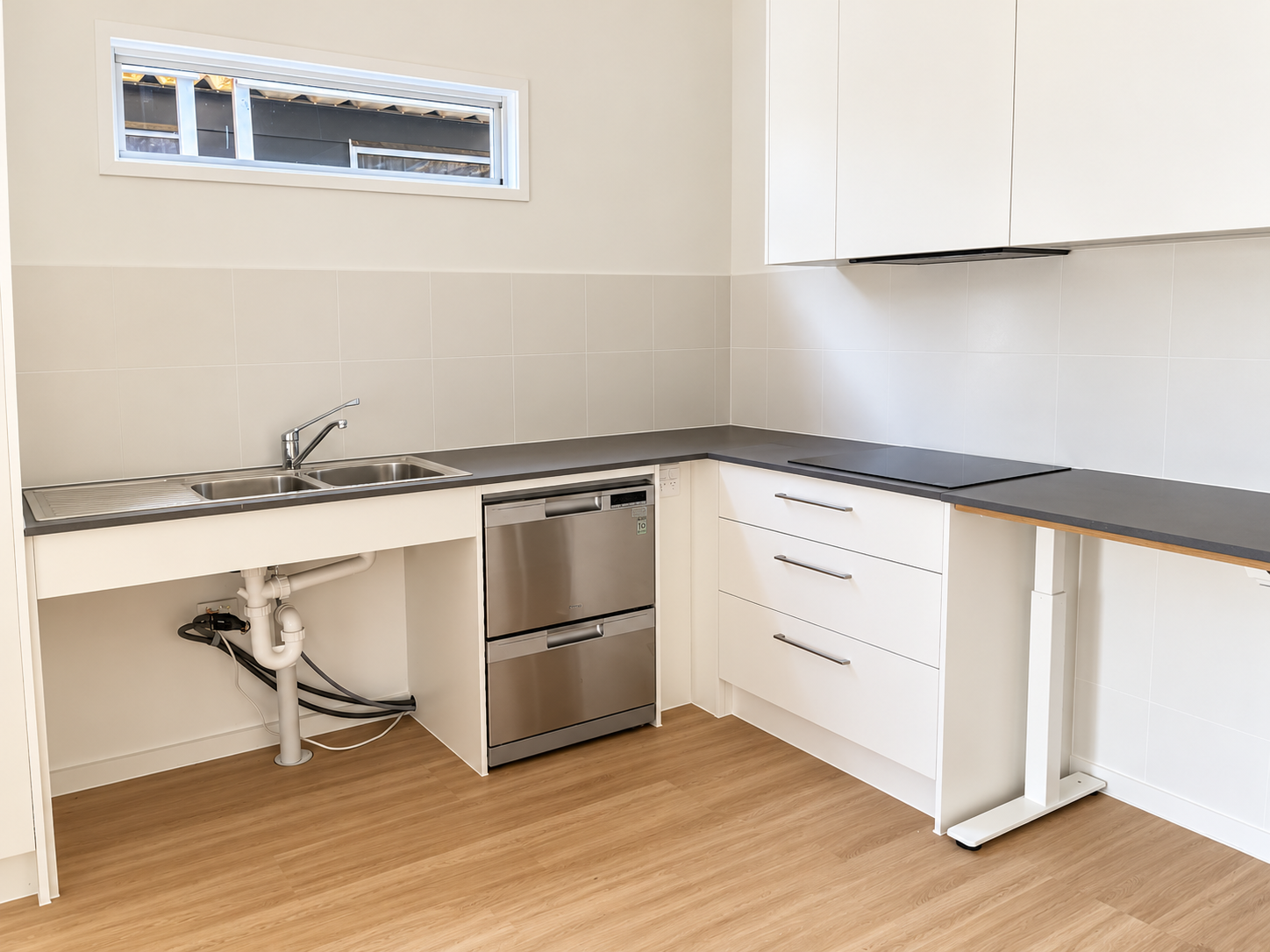 Minimal Modern Kitchenette with Sink and Cooktop.png