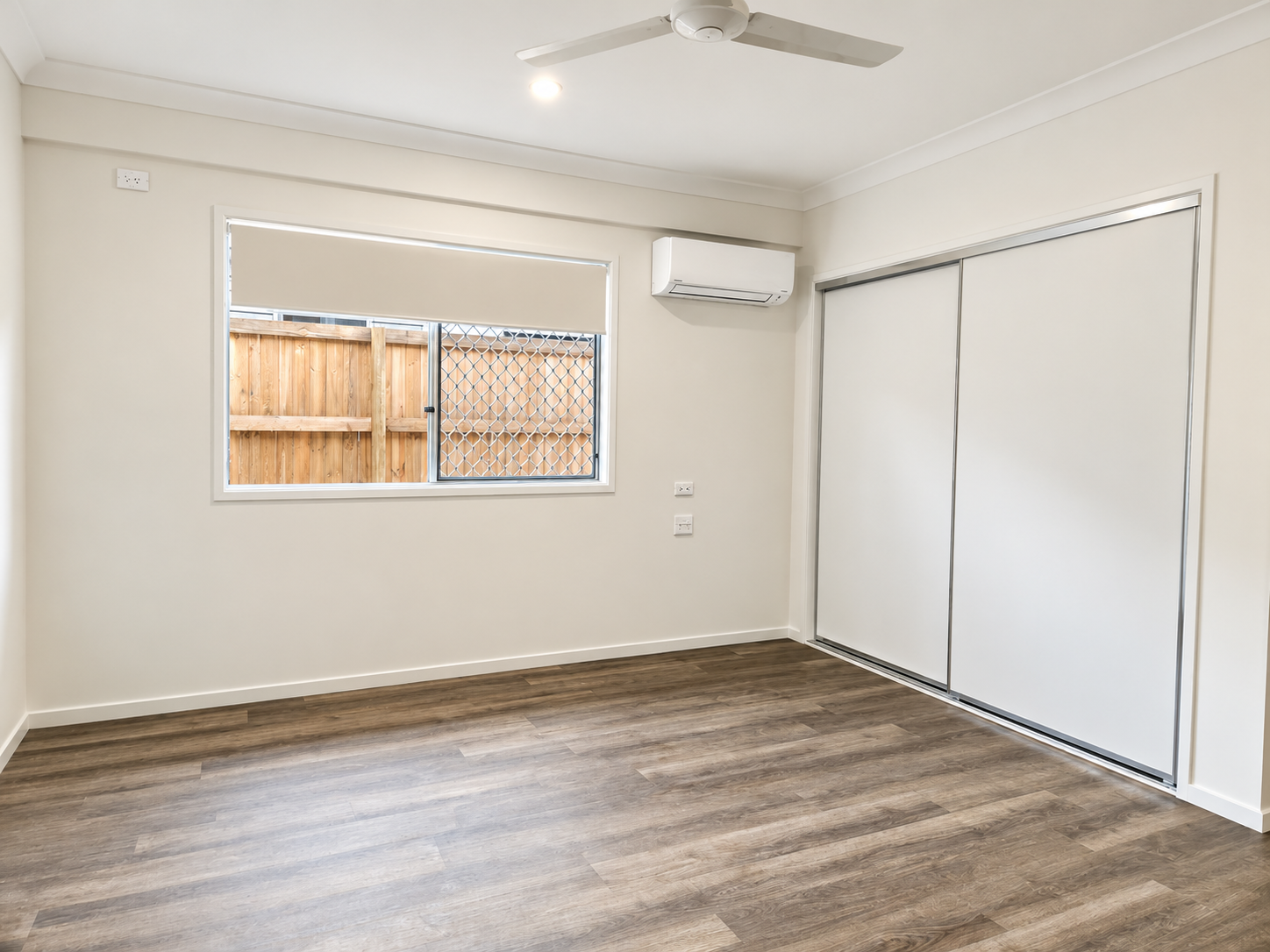 Bright Minimalist Room with Sliding Window and Wardrobe.png