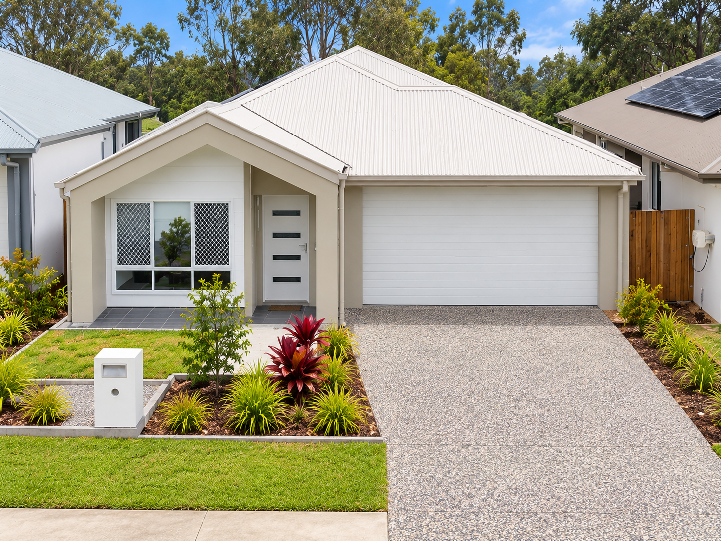 Modern Suburban Home with Manicured Yard.png