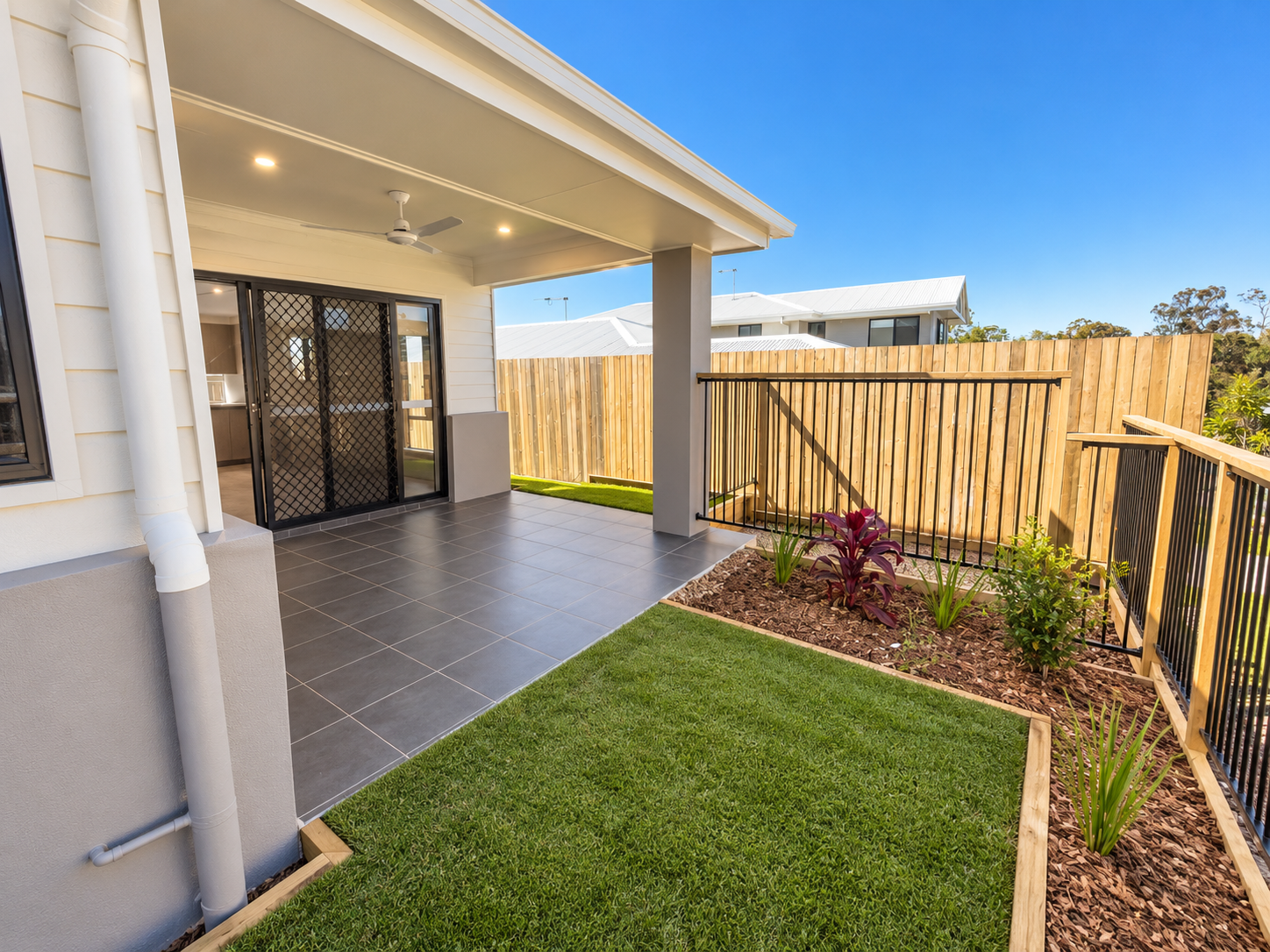 Modern Covered Patio and Landscaped Yard.png