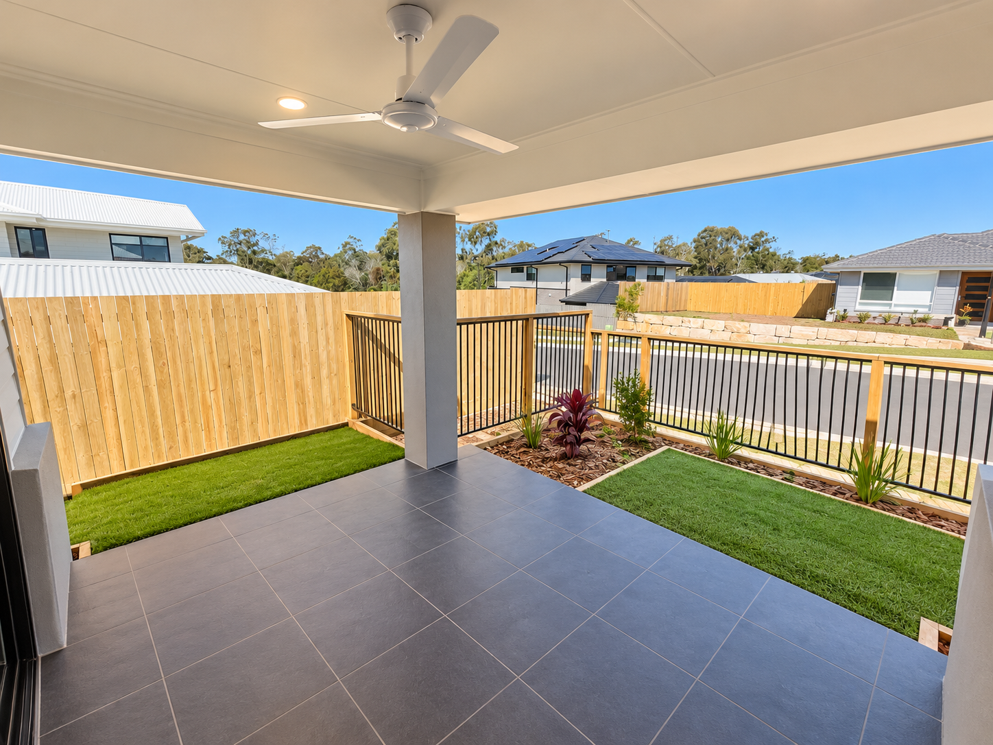 Modern Patio Overlooking Suburban Street.png